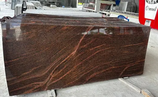 Large deep red veined slab standing in stock