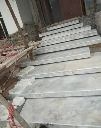 Cut stair pieces stacked at a building site
