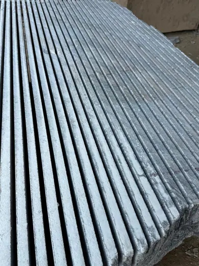 Narrow dark stone strips stacked vertically