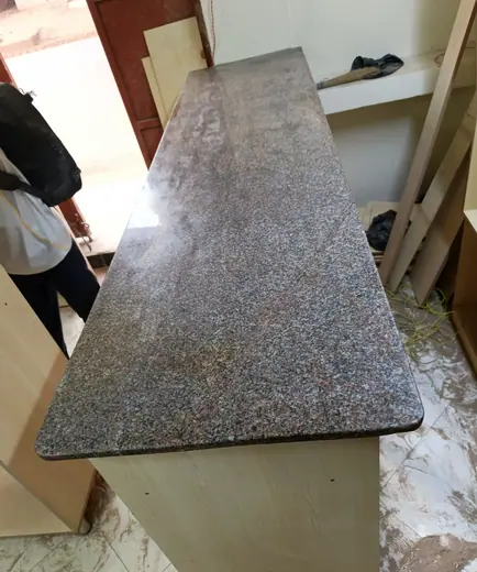 Fine grey speckling across a worktop piece