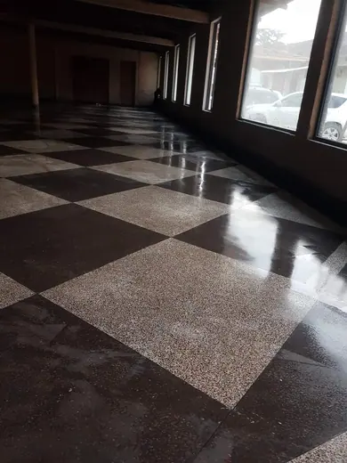 Black and pale chequerboard floor in a room