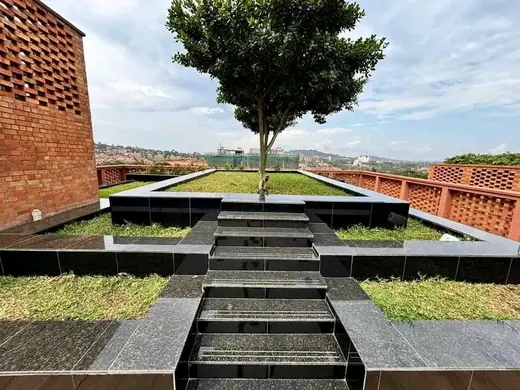 Outdoor stone steps descending through a landscaped area