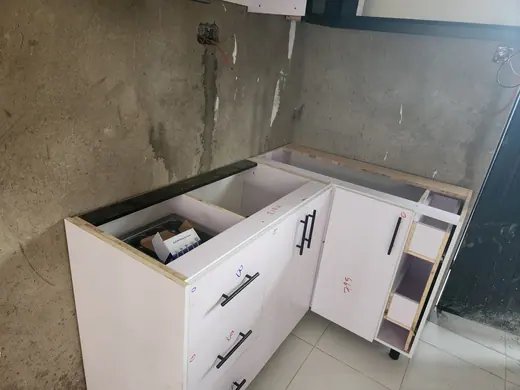 White kitchen base cabinets awaiting surface work
