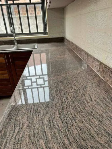 Polished patterned floor beside timber cabinetry