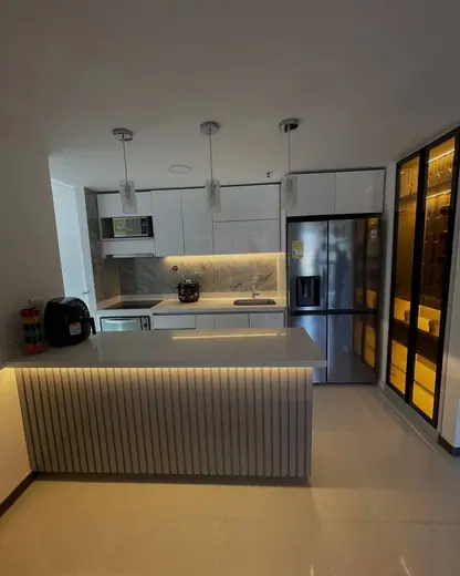 Contemporary kitchen island with an illuminated rear counter