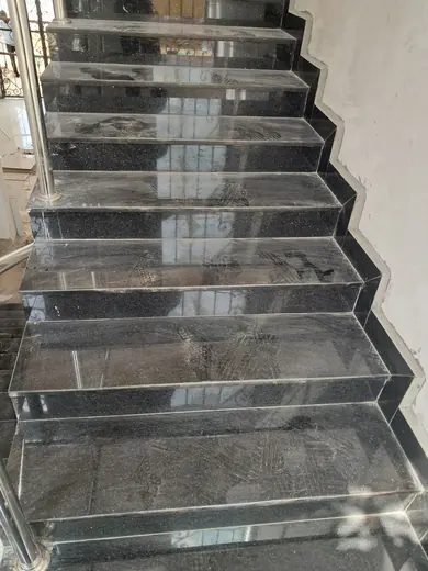 Close view of dark patterned stair treads and risers